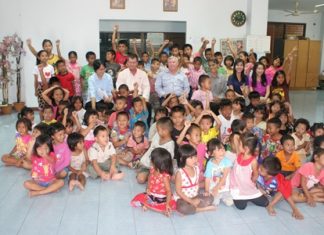 Having raised a considerable sum of money from a charity golf tournament organized by the Cuel Co. Ltd. and its affiliates recently, Steve Hovi (seated 2nd left), the pre-commissioning manager donated 1,573,000 baht to the Fountain of Life Center for use in caring for the children at the centre.